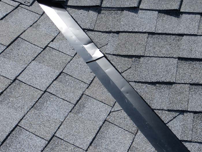 broken , dented roof flashing , roof leak in heavy rain